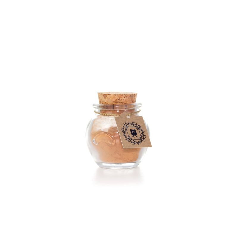 Featherlight Foundation Golden Medium shade glass jar with cork and hang tag
