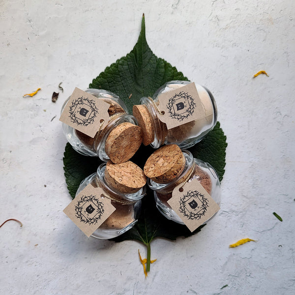 Featherlight Foundation glass jars with corks on Mulberry Leaf