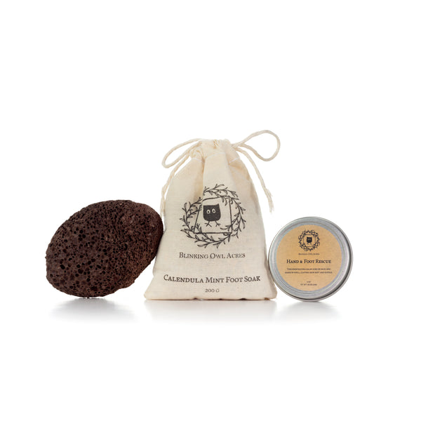 Natural dark pumice stone, cotton bag containing Calendula Mint Foot Soak and Hand & Foot Rescue Balm