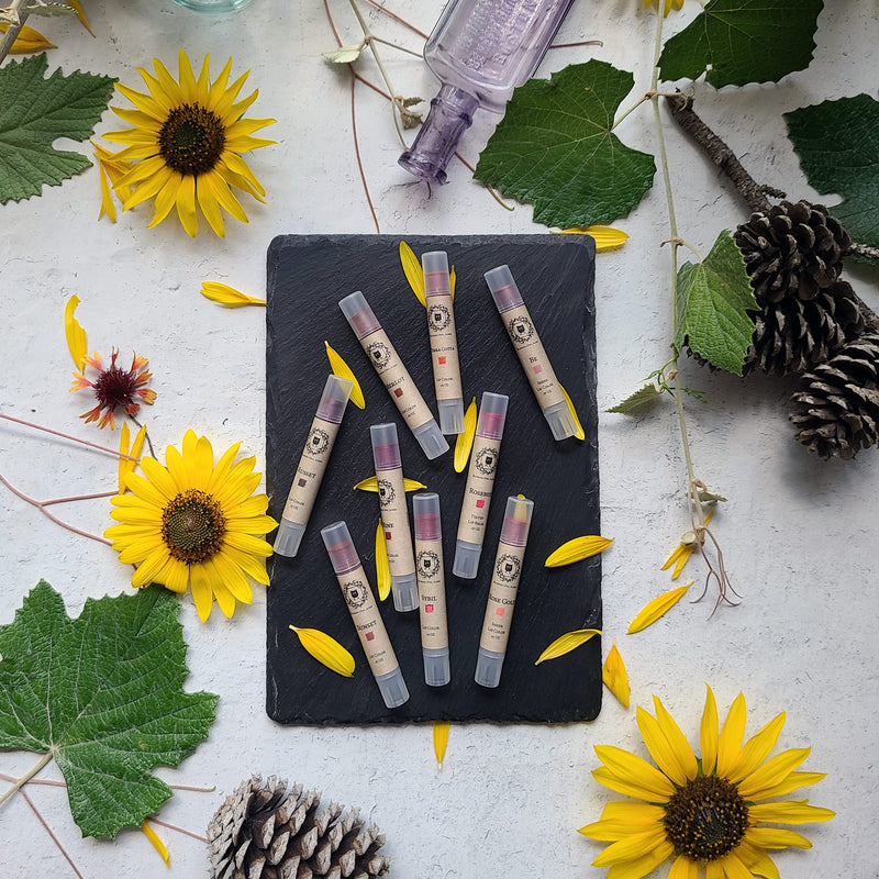 9 Lip Colors, Tubes with flower petals and botanical elements, vintage glass bottle, slate, pine cones