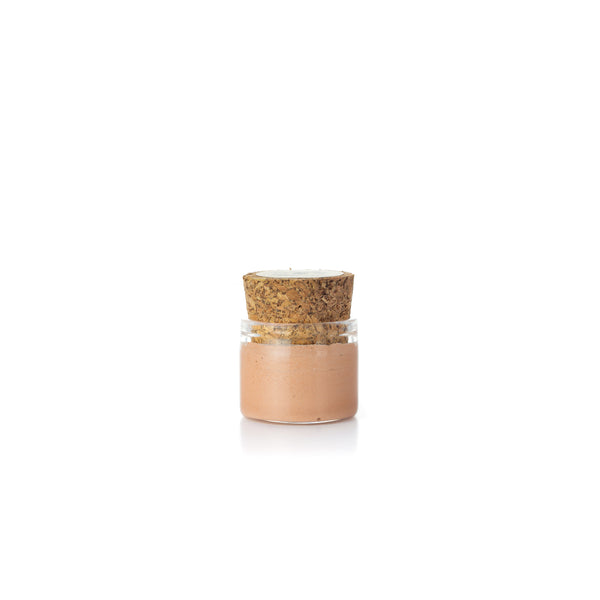 Small glass jar with cork Primelighter primer and eye makeup base